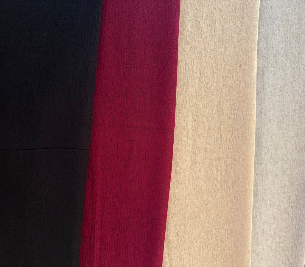 Colors of the essential cotton scarf. Grey, Burgundy, black, and beige.