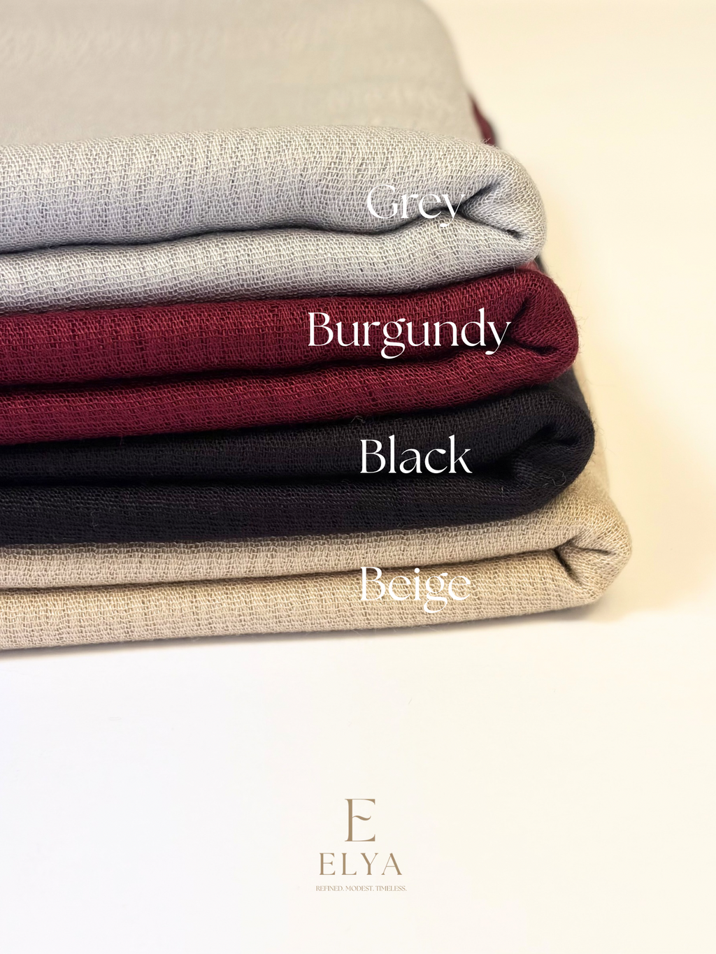 Colors of the essential cotton scarf. Grey, Burgundy, black, and beige.