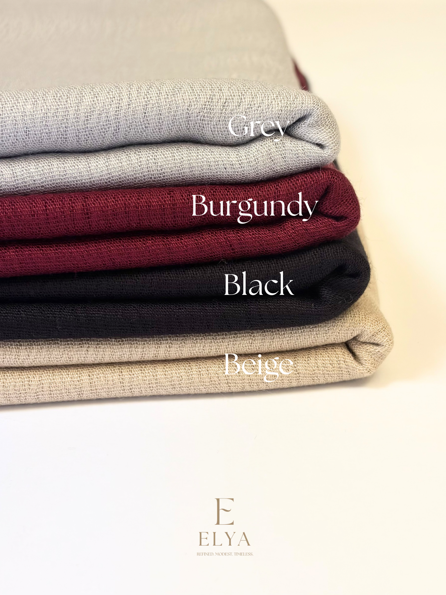 Colors of the essential cotton scarf. Grey, Burgundy, black, and beige.