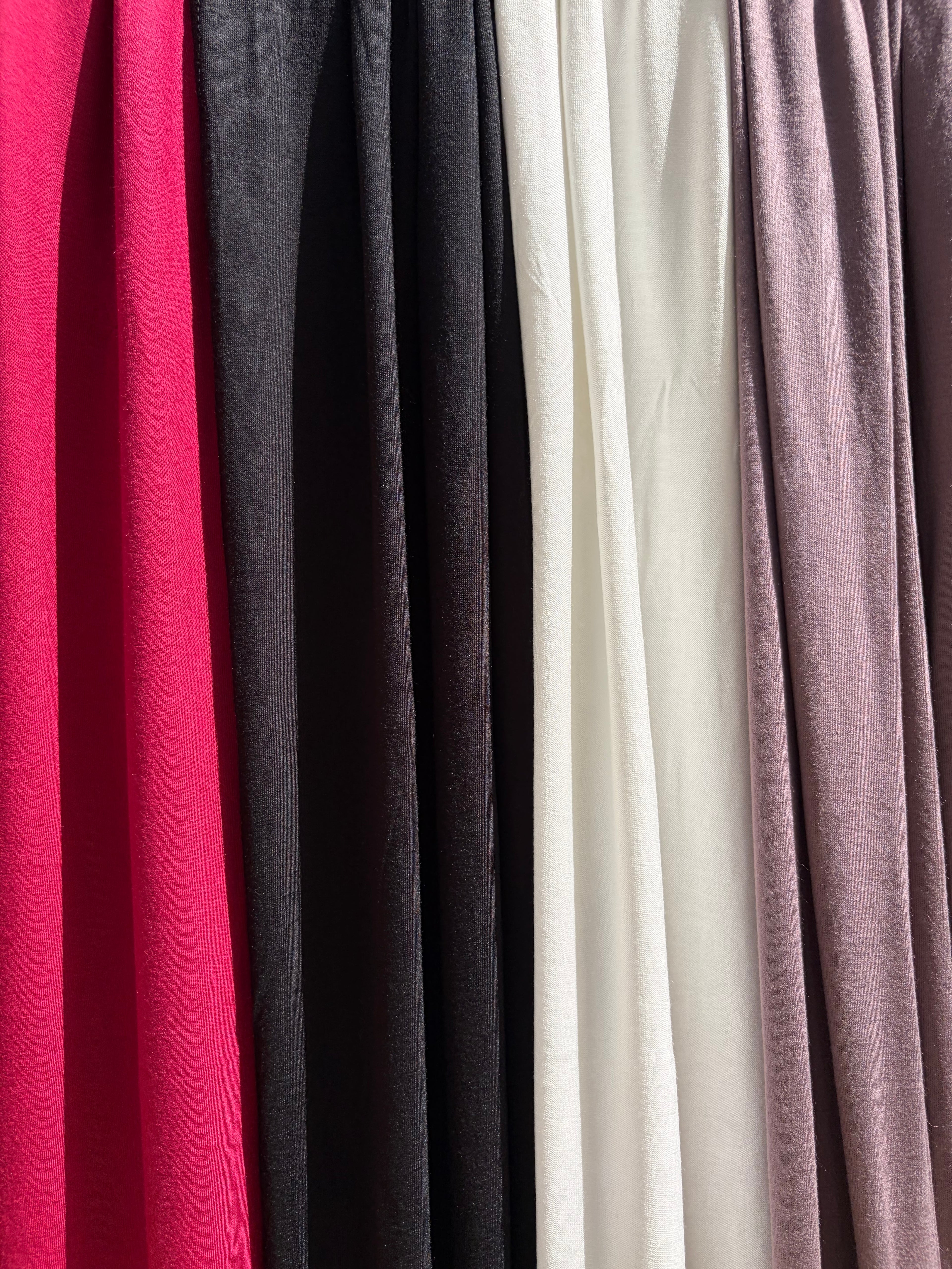 Close up on Jersey set scarf in 4 colors, black, off-white, maroon & deep lilac